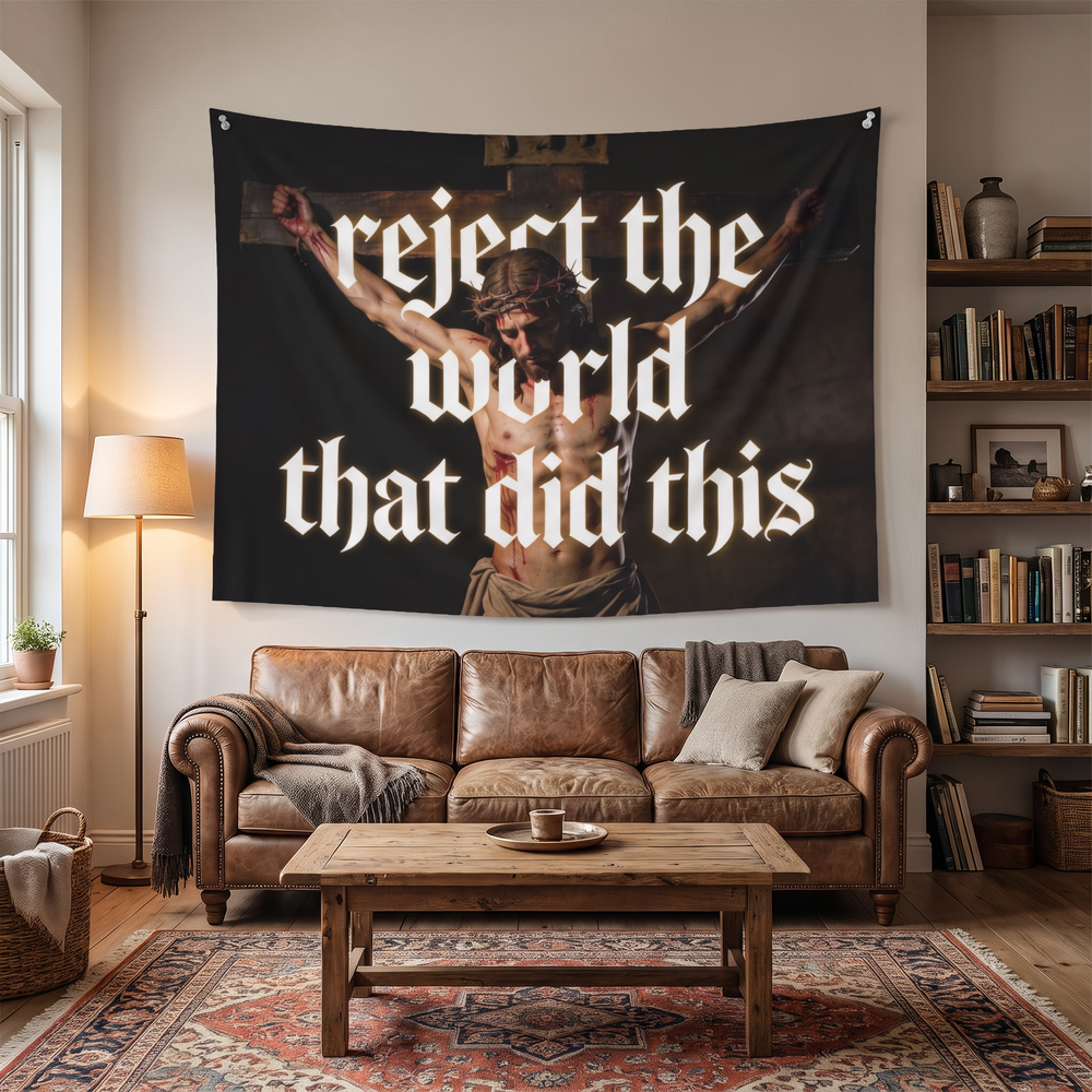 Reject the World Christian wall tapestry displayed above a sofa in a styled living-room mockup.