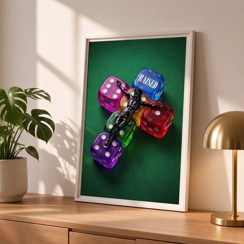 RAISED green Jesus poster in a styled tabletop mockup beside a plant and brass-colored lamp.
