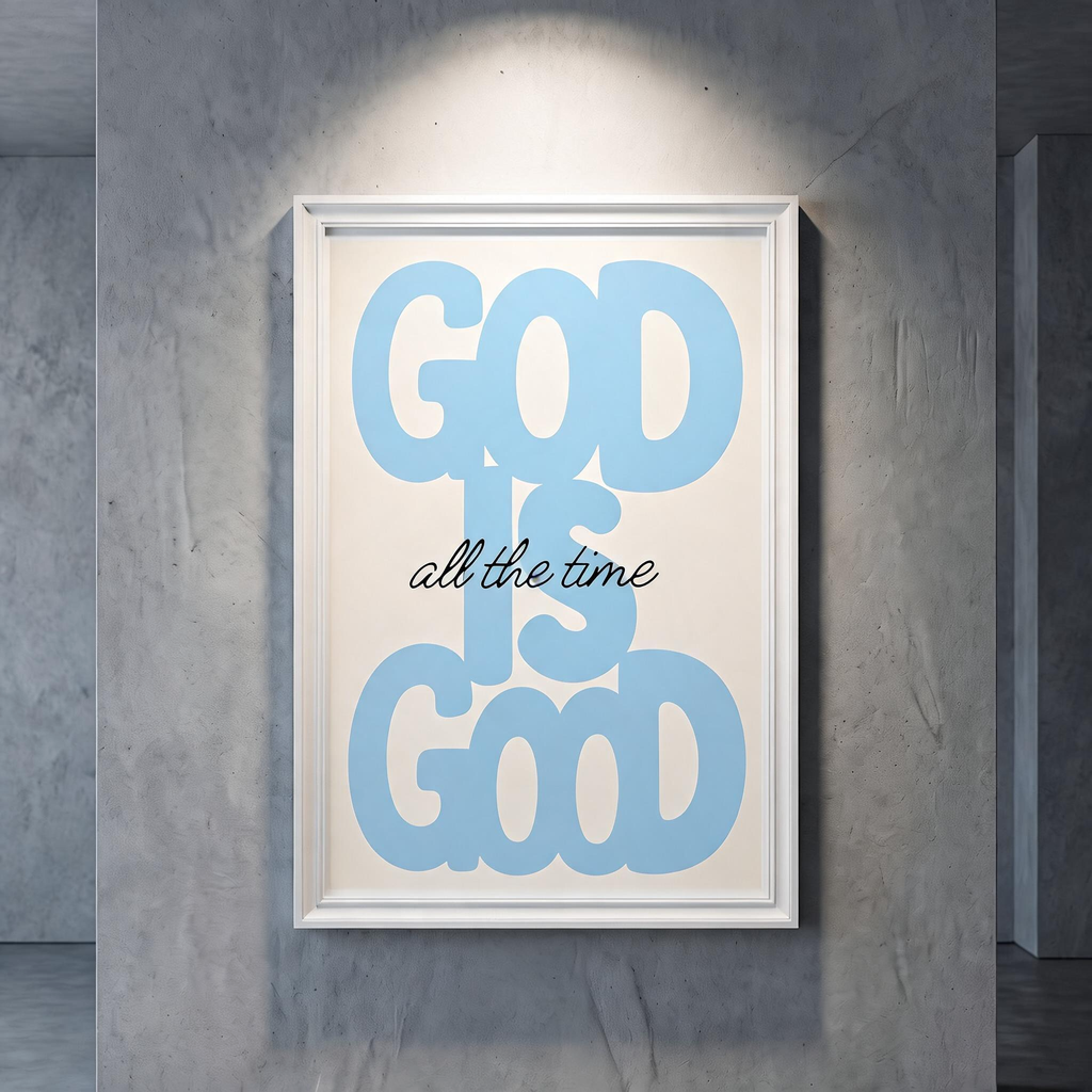 God Is Good blue typography poster with black “all the time” script on cream, shown in a white frame against a gray wall.