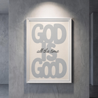 God Is Good grey typography poster with black “all the time” script on cream, shown in a white frame against a gray wall.