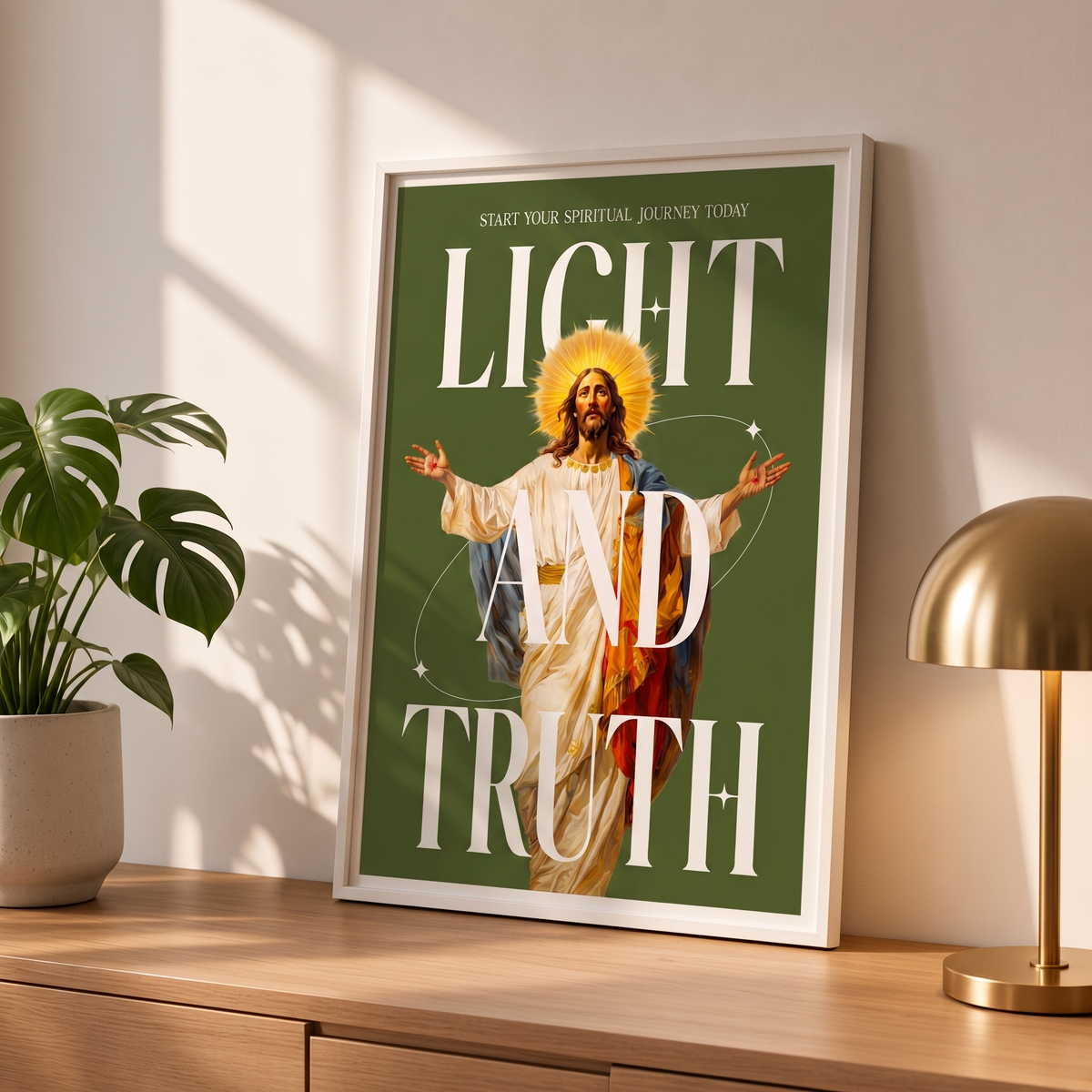 Light & Truth green Jesus poster in a styled tabletop mockup beside a plant and a brass-colored lamp.